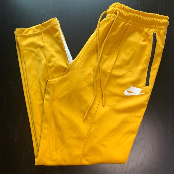 nike track pants yellow